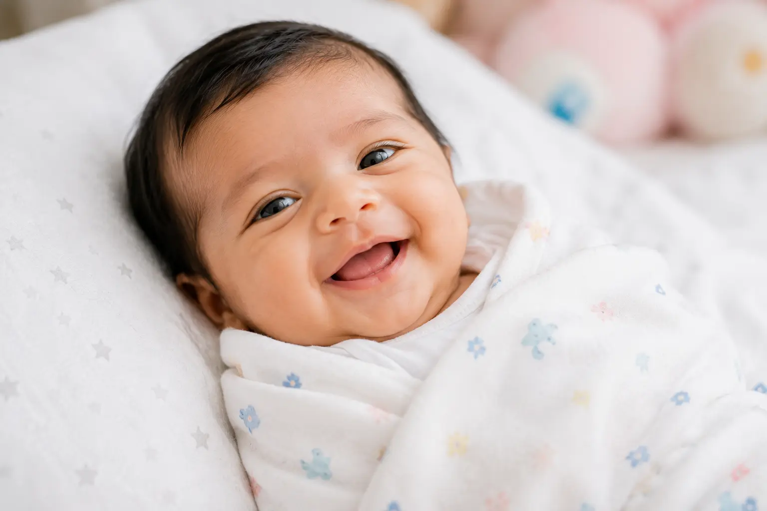 Smiling healthy newborn baby cared for at Kranthi Children's Clinic, Pragathi Nagar, Hyderabad